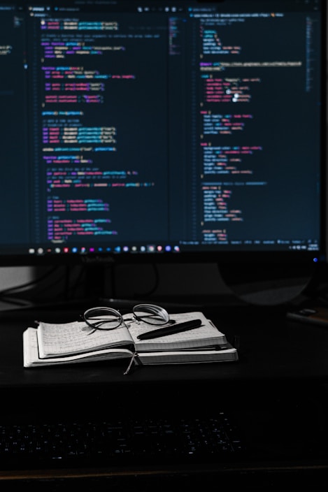 A vibrant workspace with a laptop showing an online course interface and colorful notes around