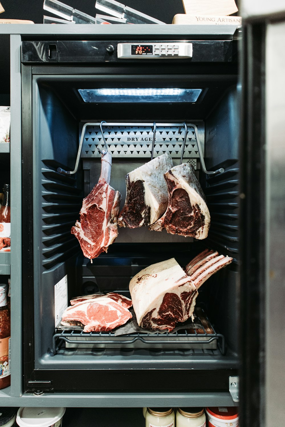 raw meat in black plastic container