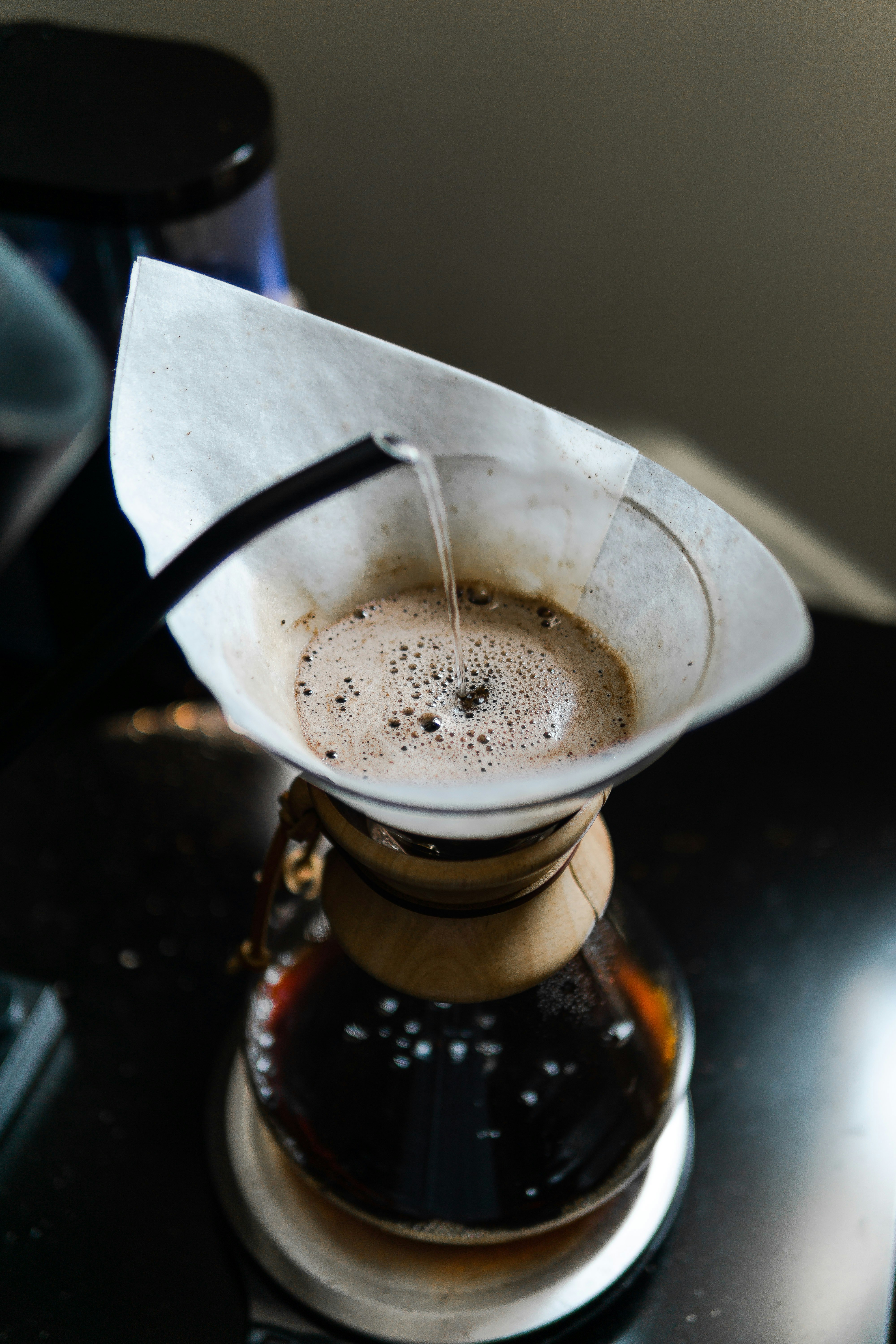 clear glass mug with brown liquid