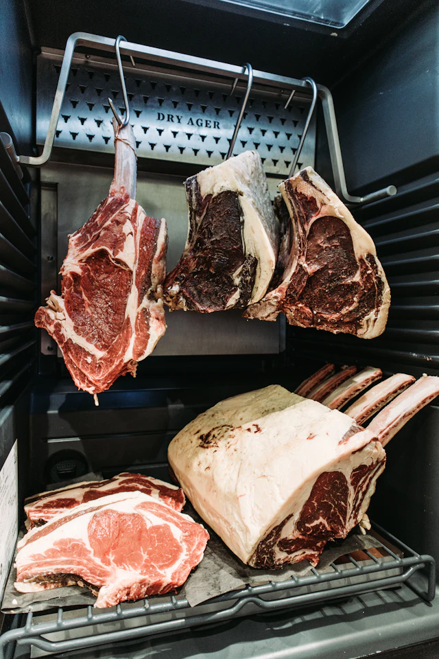 Dry-aging meat locker by Kyle Mackie on Unsplash