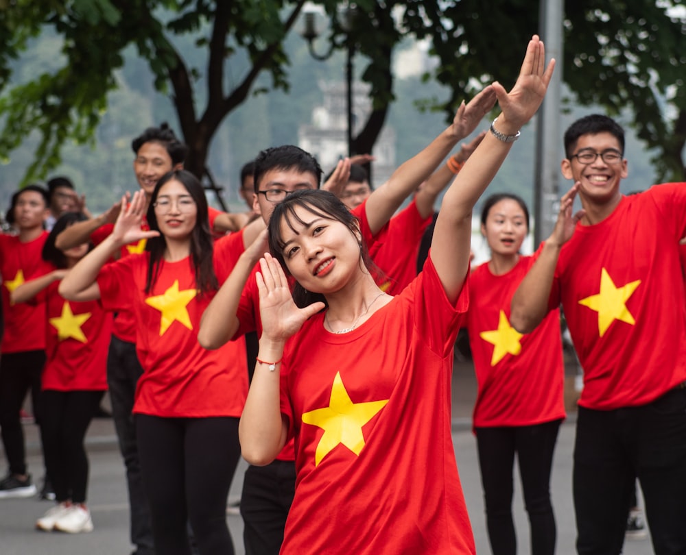 group of people in red and yellow shirts