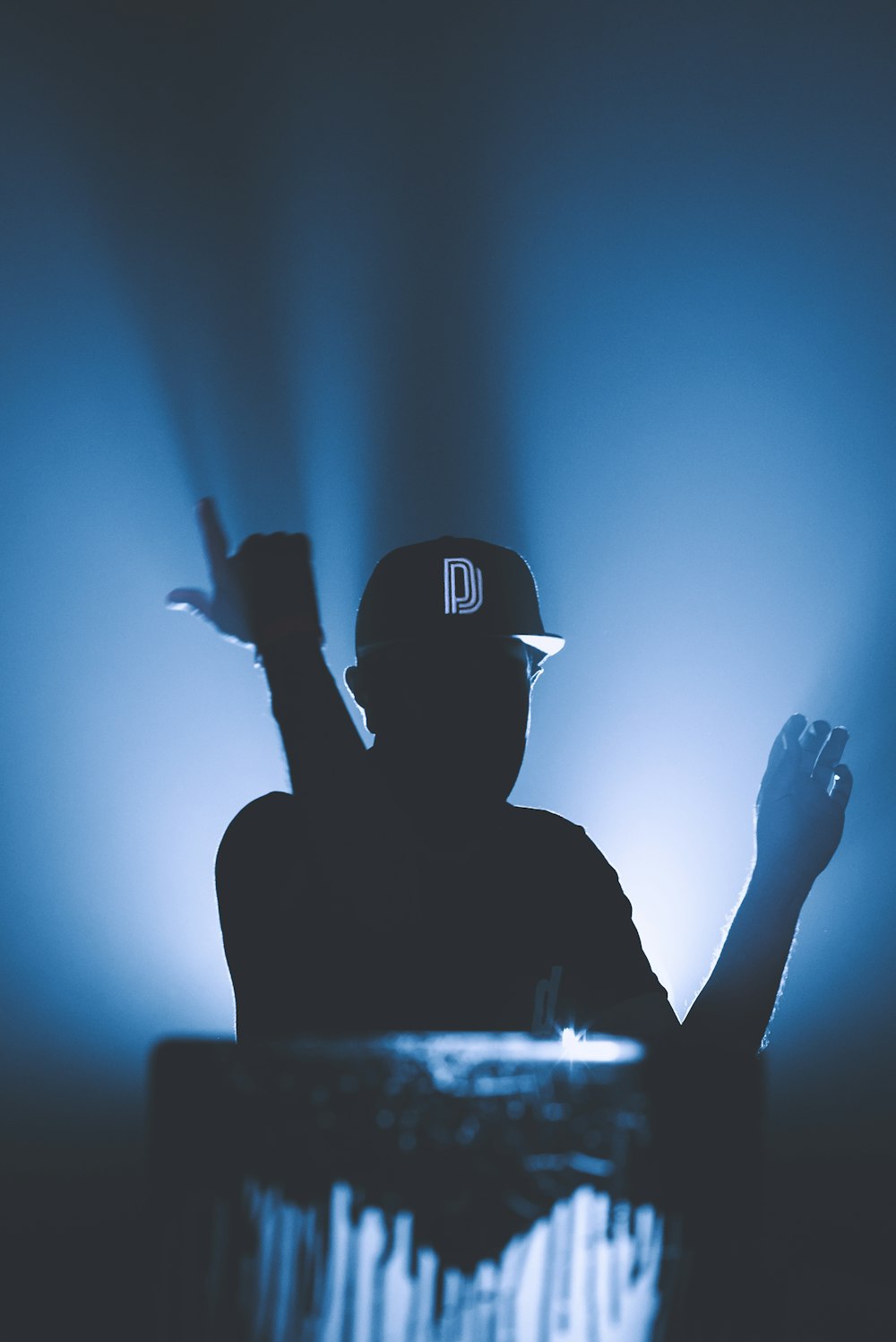 silhouette of man wearing black cap