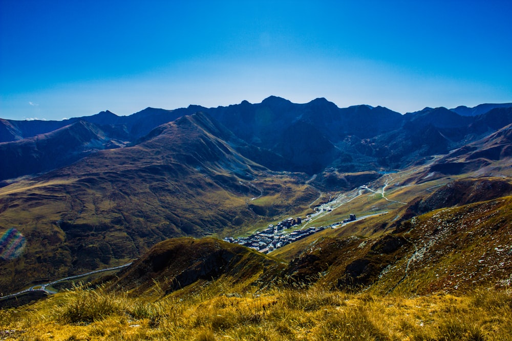 brown and green mountains under blue sky during daytime