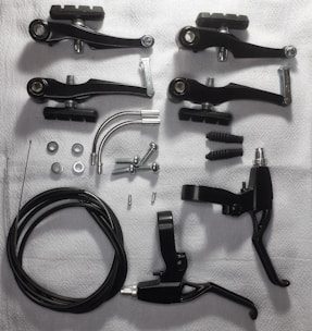 An assortment of brake pads and rotors on a table.