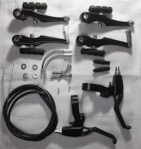 Close-up of bicycle accessories neatly arranged on a wooden table.