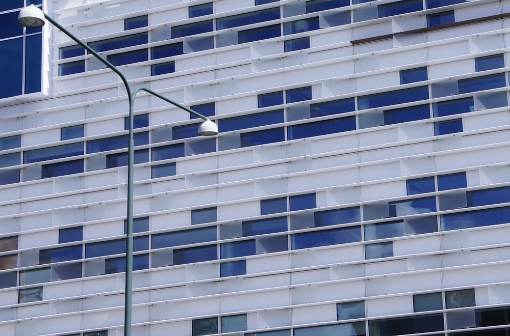 a street light in front of a tall building