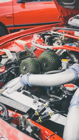 Classic red and gray car engine.