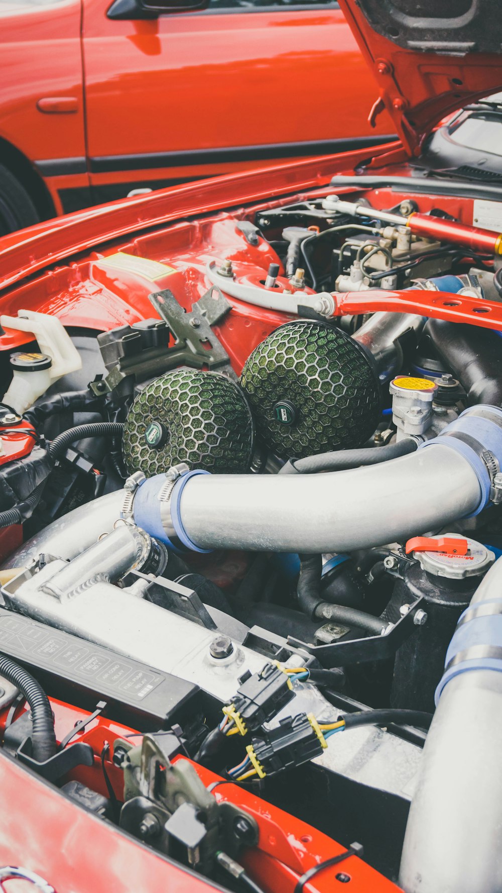 red and gray car engine