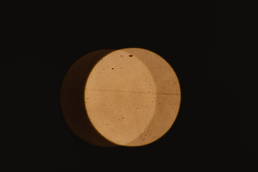 a close up of a round object in the dark