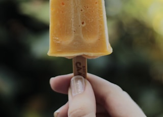 yellow ice cream in stick