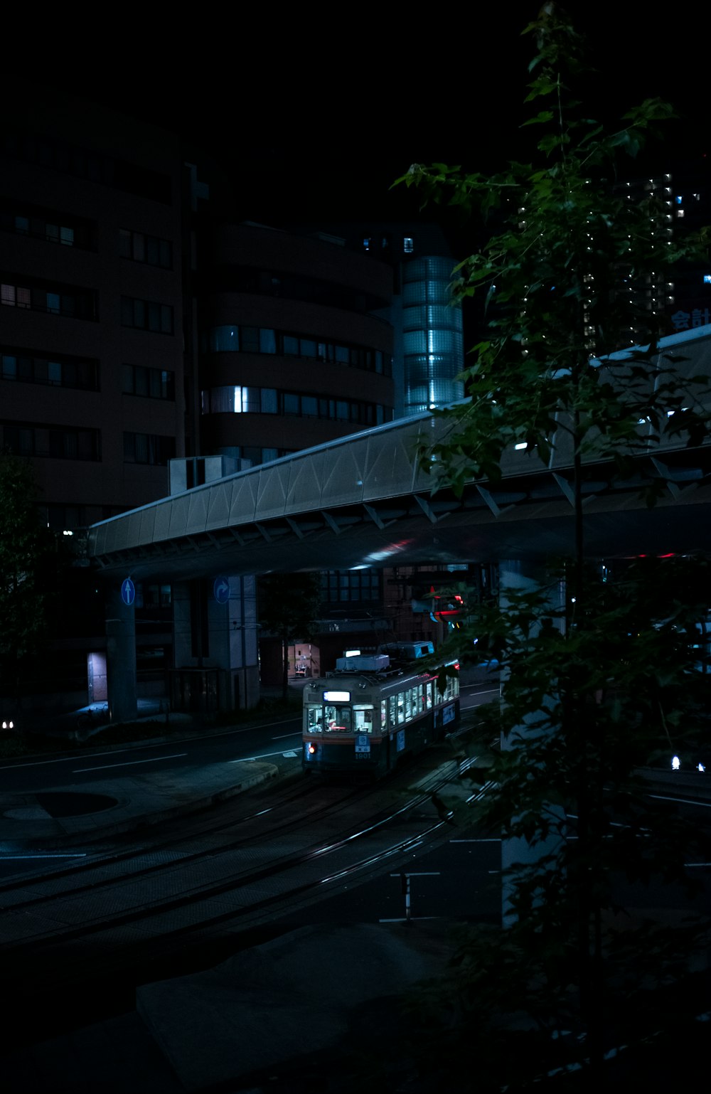 cars on road near building during night time