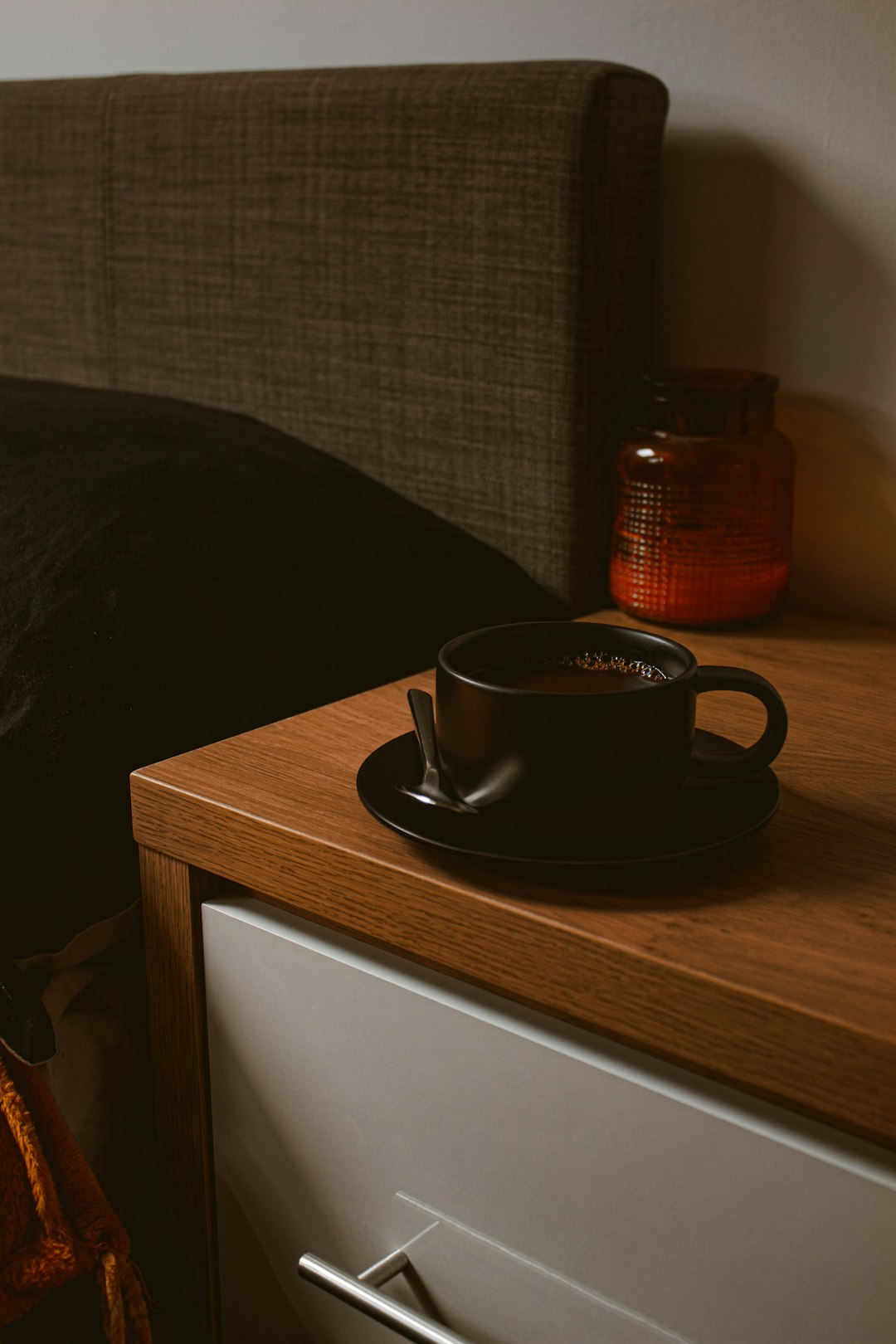 black ceramic mug on brown wooden table