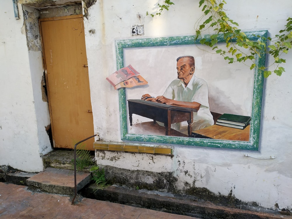 man in white suit sitting on bench