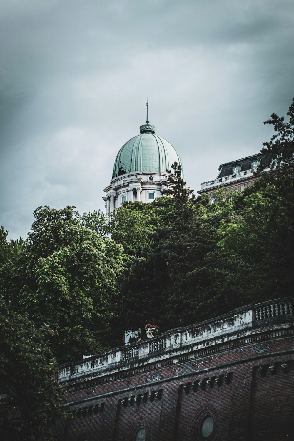 white and green dome building under cloudy sky during daytime