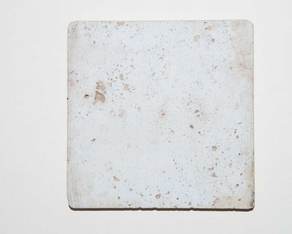 white rectangular board on white surface