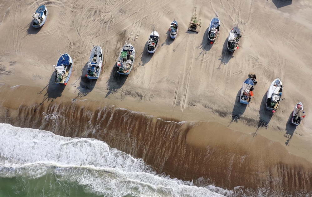 aerial view of people riding on a boat on a beach