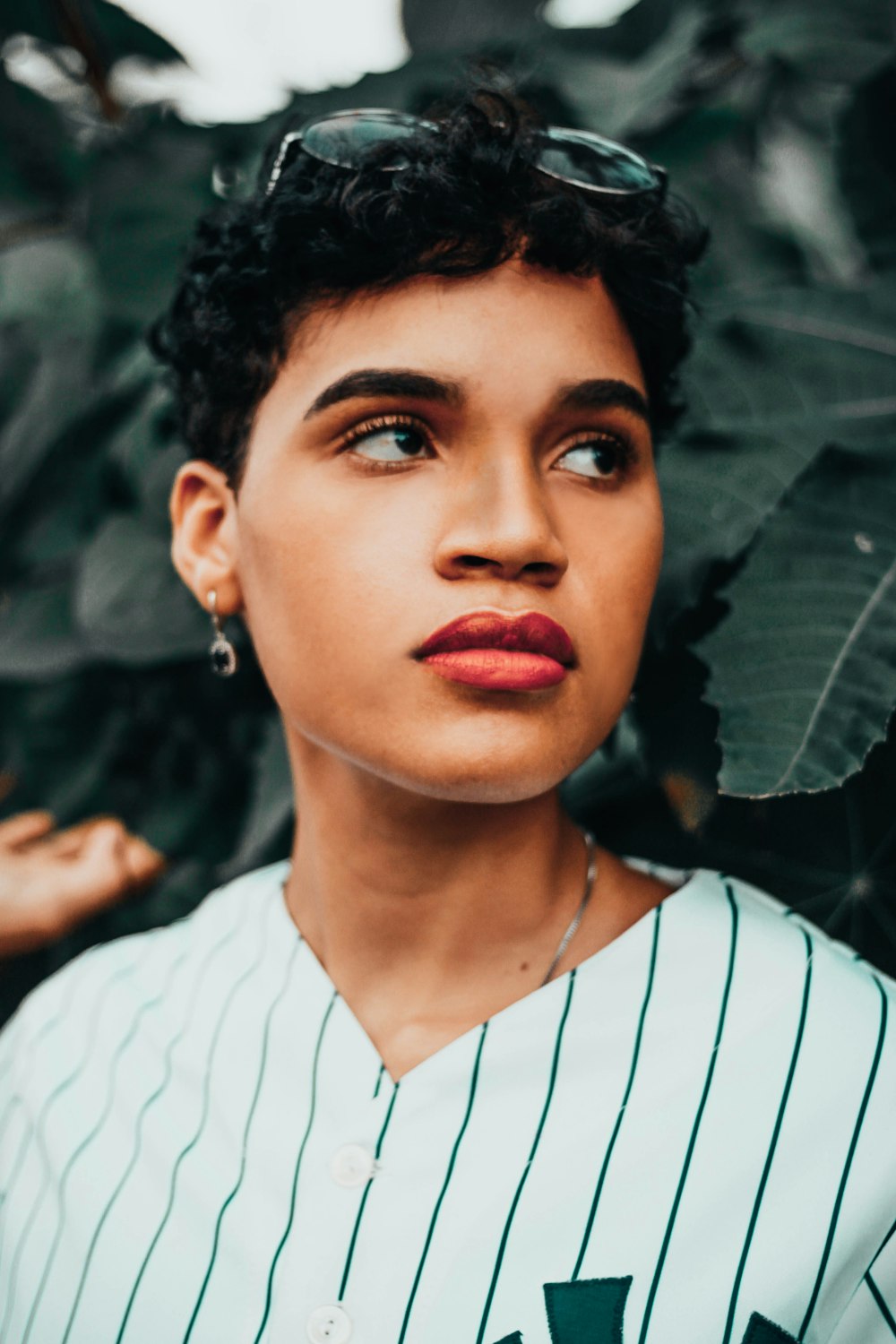 woman in white and black striped shirt