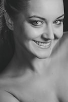 A close-up of a friendly person smiling at the camera.