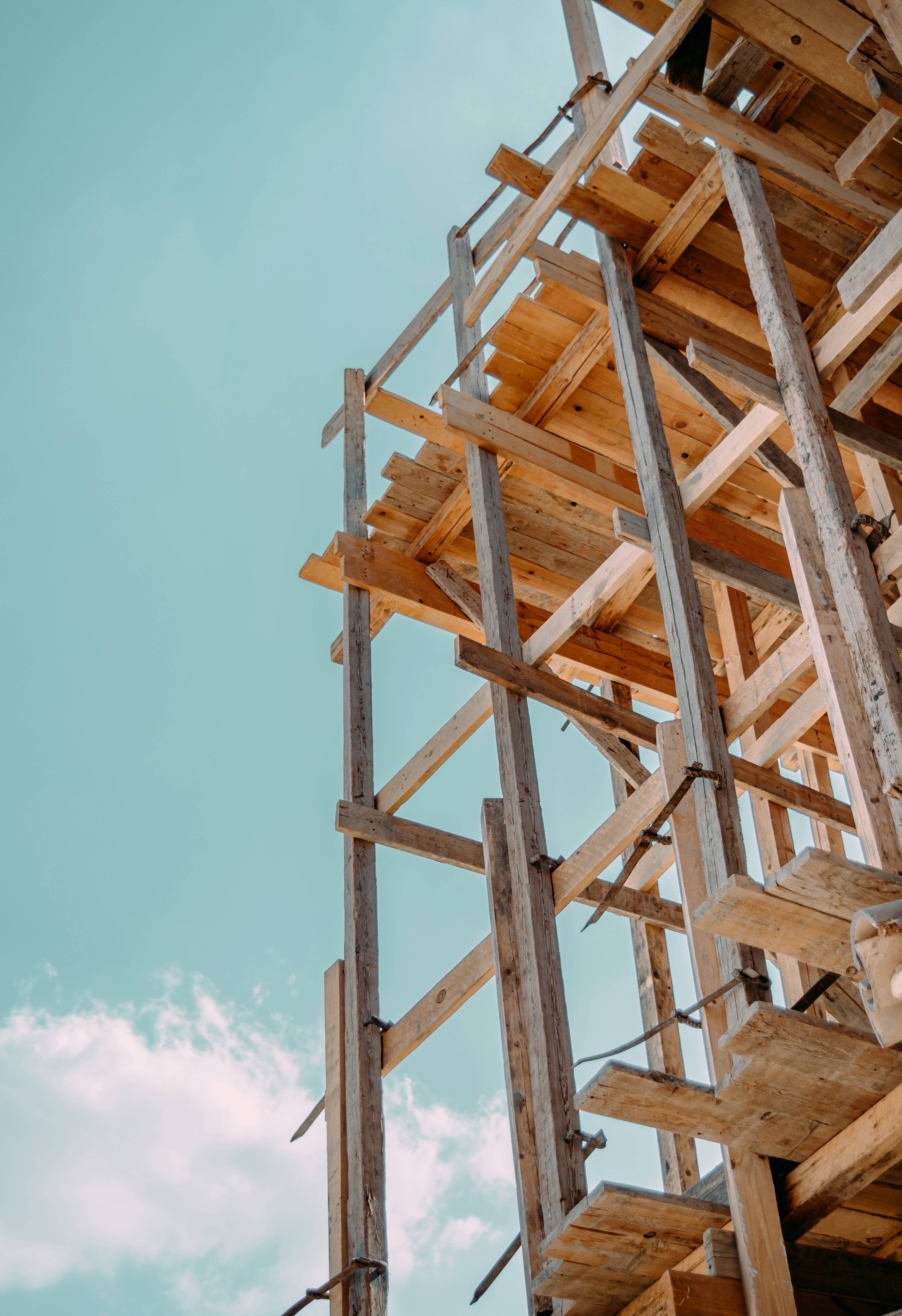brown wooden tower under blue sky during daytime