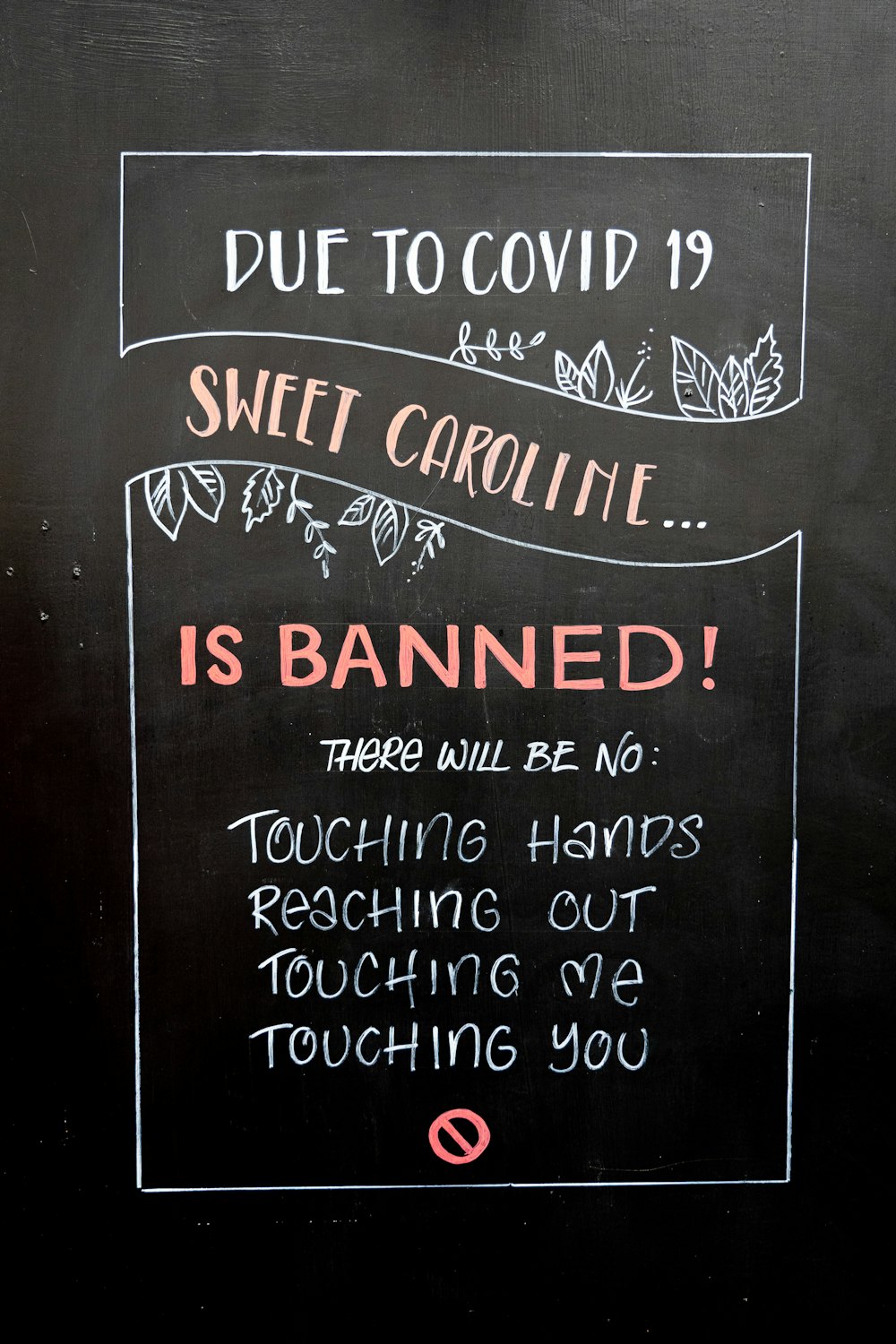 a blackboard sign on a wall