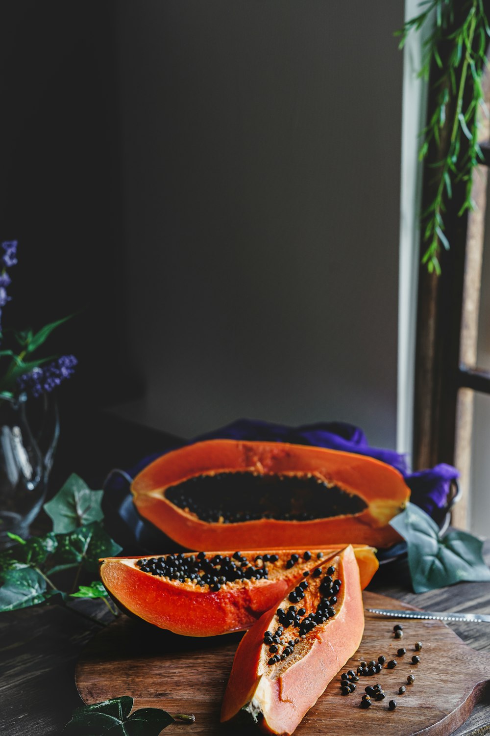 orange flower in brown pot