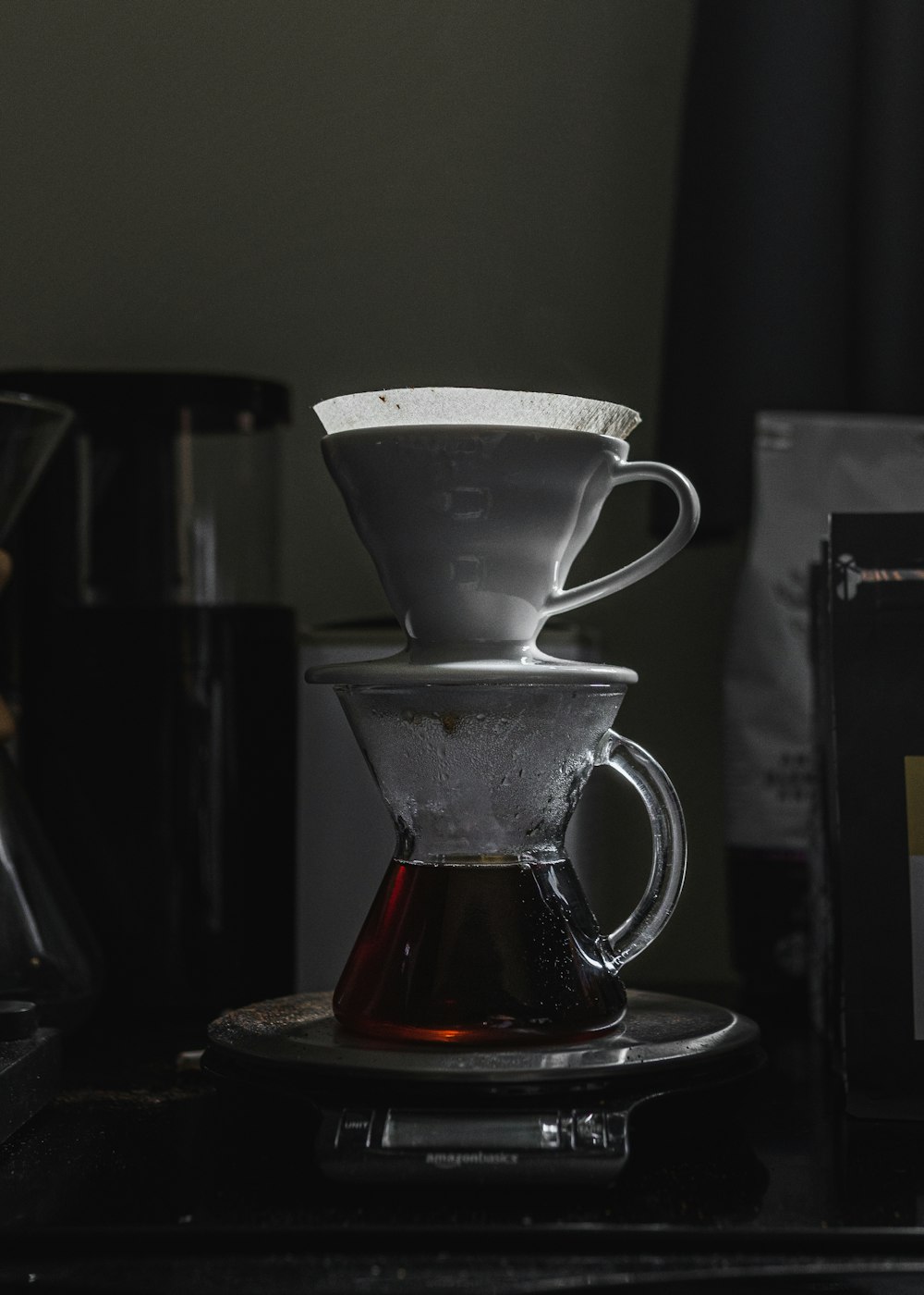 clear glass mug with brown liquid