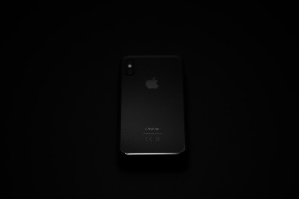 black iphone 7 plus on black surface