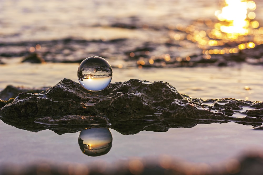 water drop on black rock