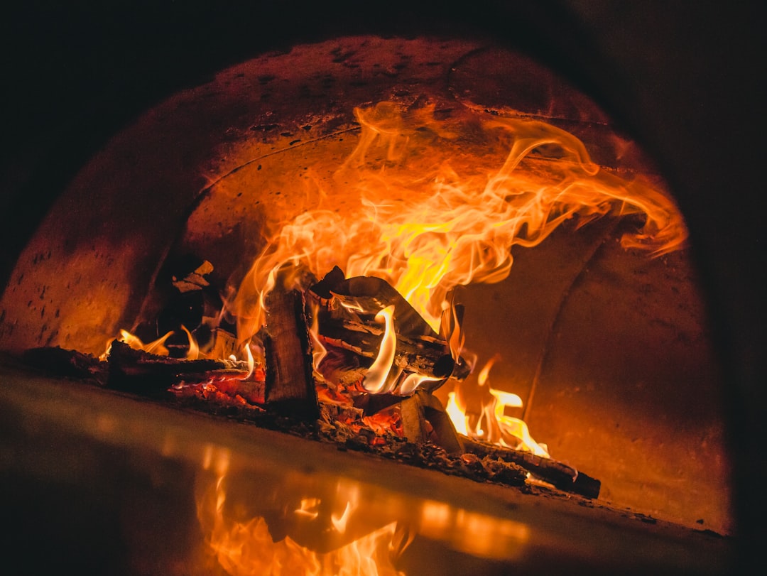  burning firewood in fire pit oven