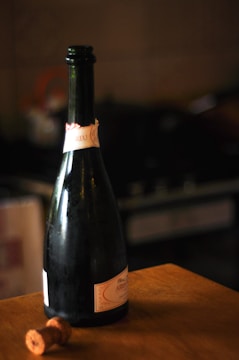 Bottles sealed with sparkling wine corks in a cellar