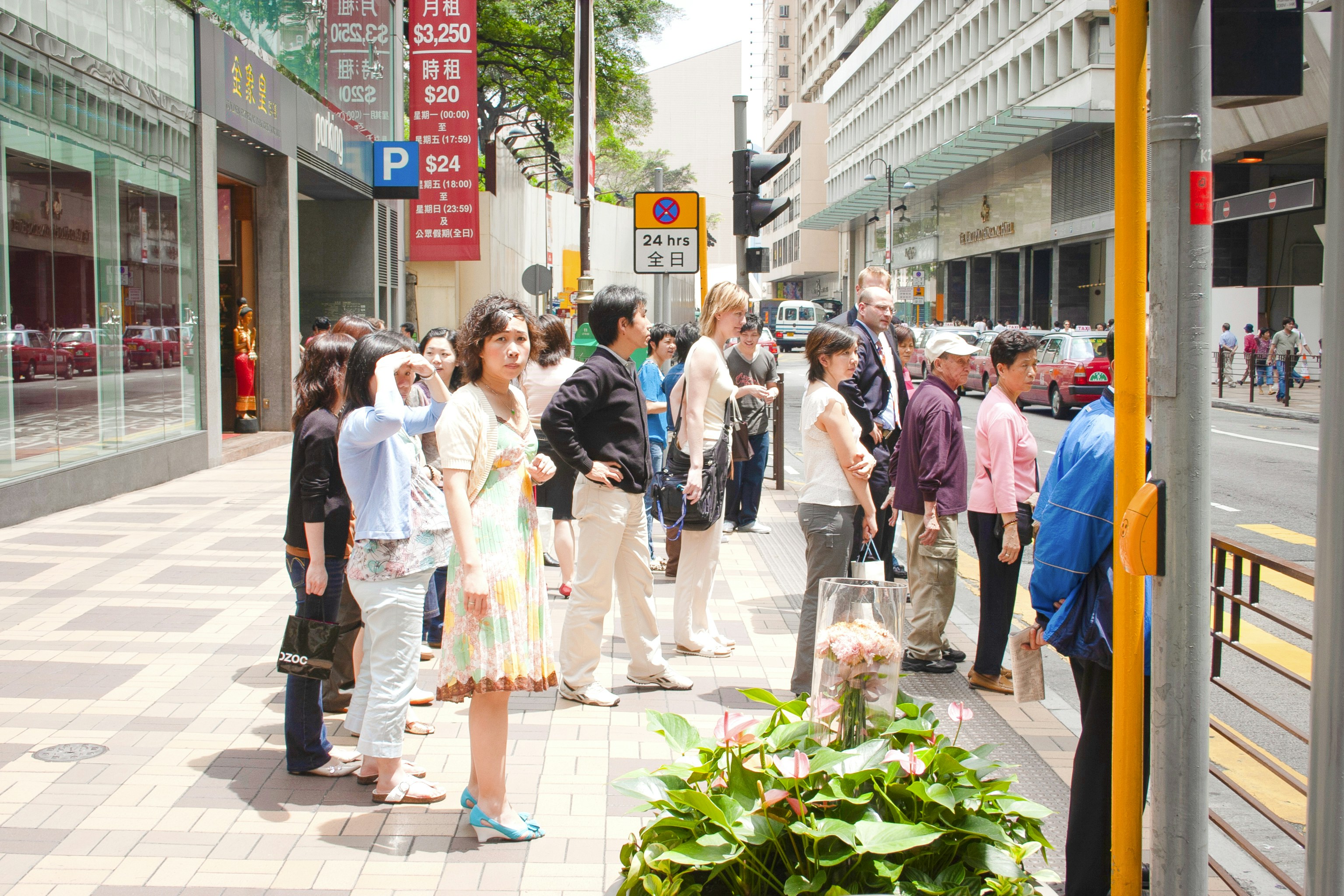 people walking on sidewalk during daytime