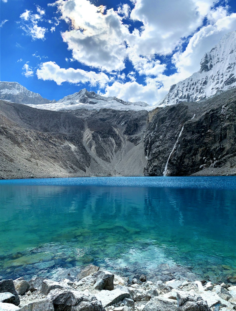 blue lake near gray mountain during daytime photo – Free Nature Image