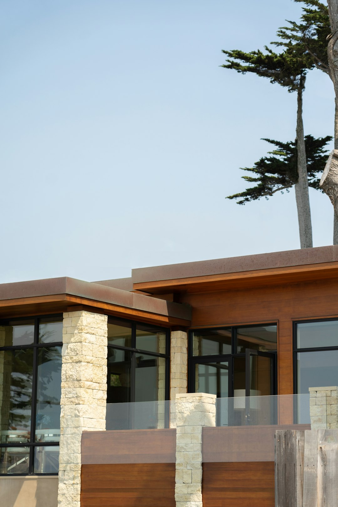 brown concrete building near green trees during daytime