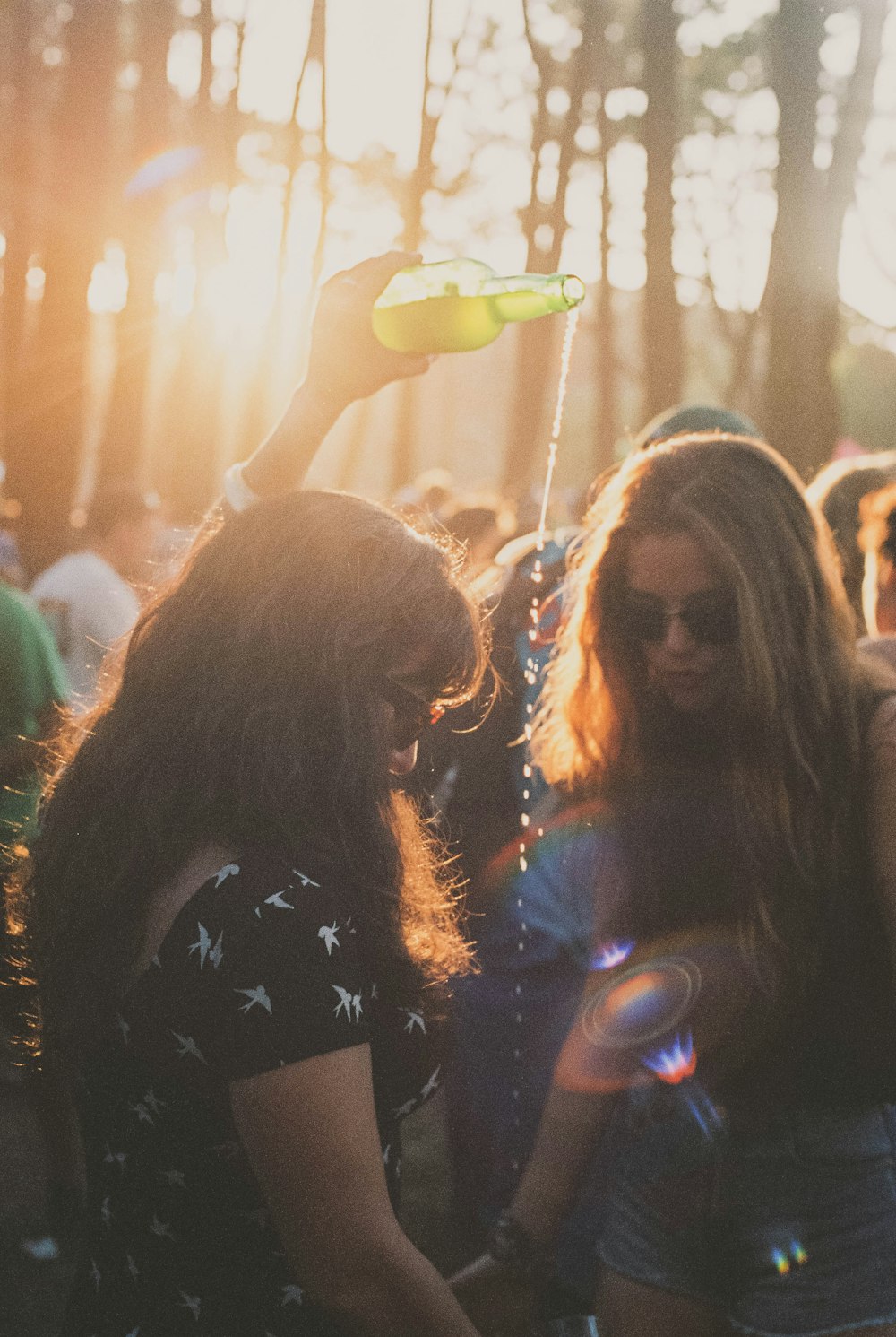 woman in black long sleeve shirt standing in front of people during night time