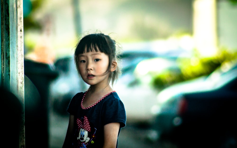 girl in blue and red floral dress