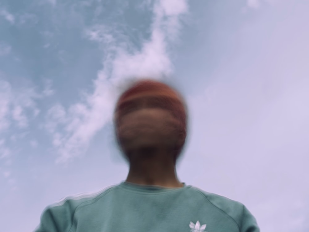 man in blue crew neck shirt under blue sky during daytime