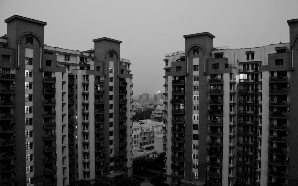 grayscale photo of high rise buildings