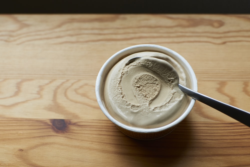 white ceramic cup with white ice cream