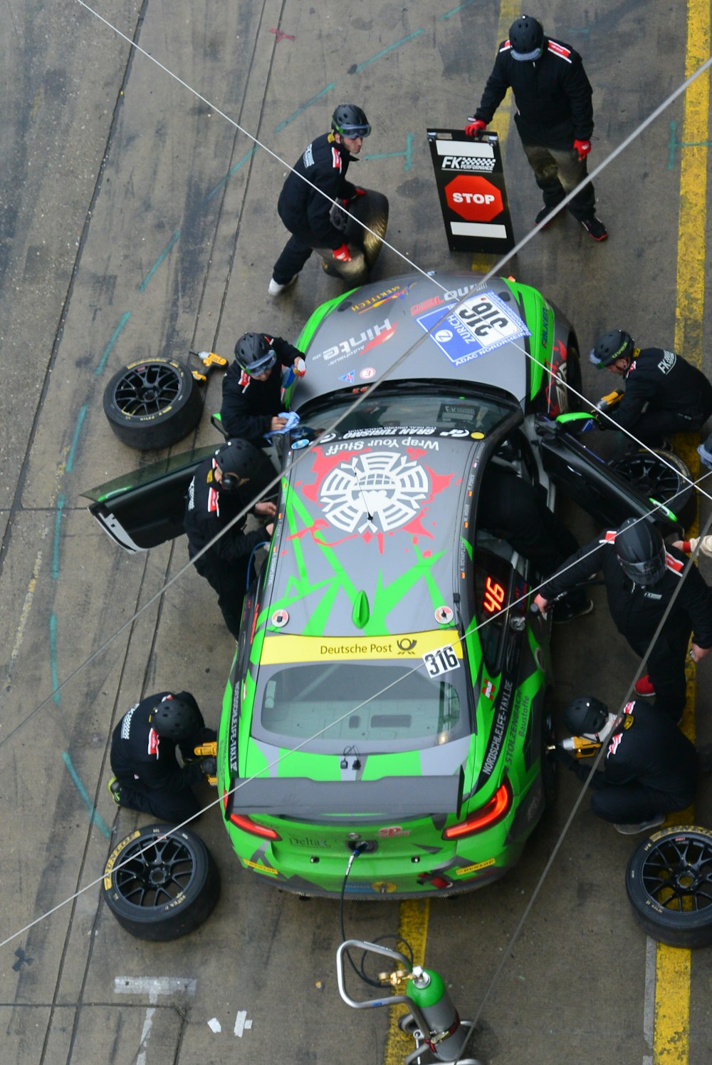 green and black racing car