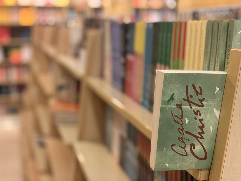 a book shelf in a library filled with books