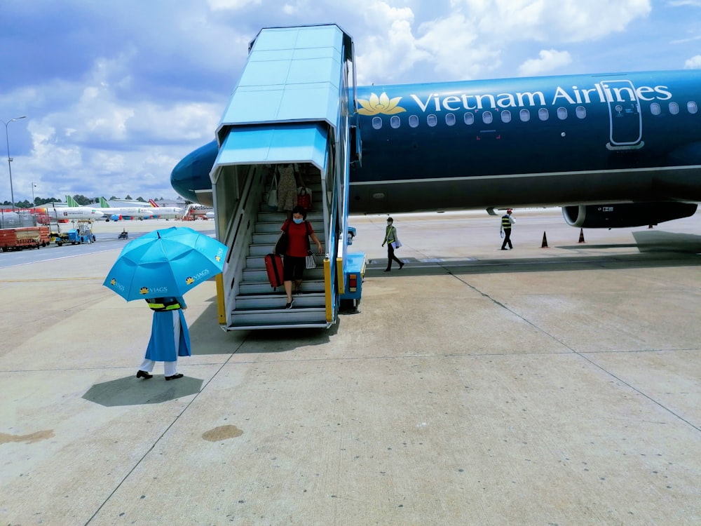 blue and white passenger plane