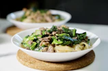 green vegetable dish on white ceramic plate