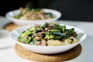 green vegetable dish on white ceramic plate