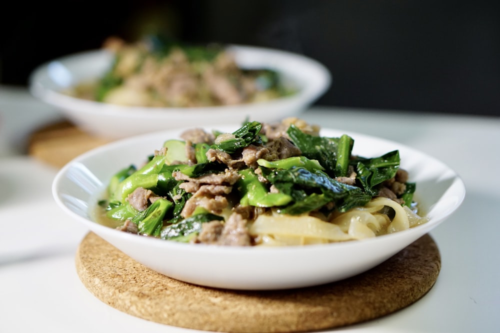 green vegetable dish on white ceramic plate