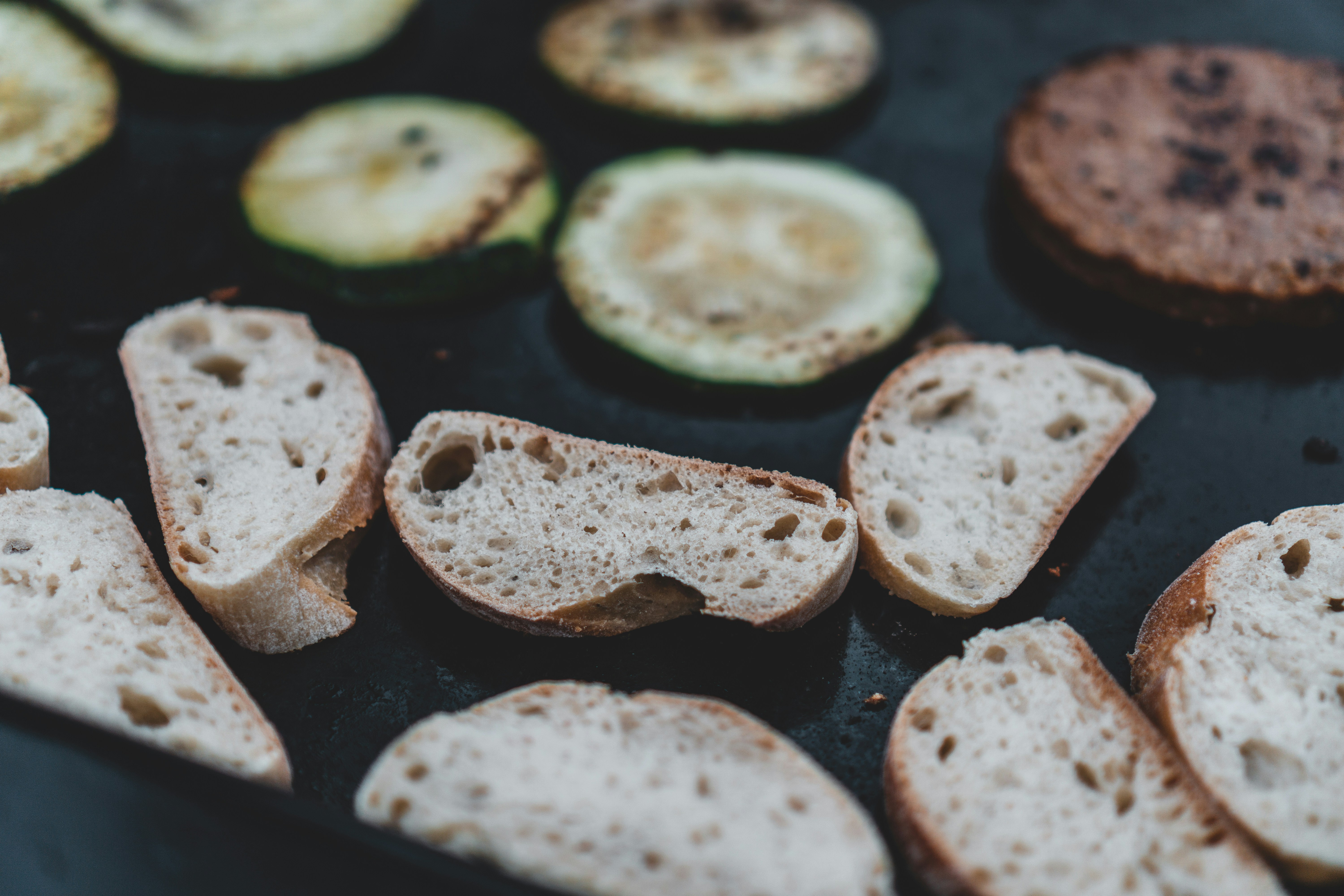 sliced cucumber on black tray