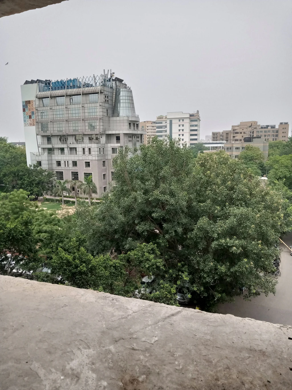 Residential building among green trees in New Delhi