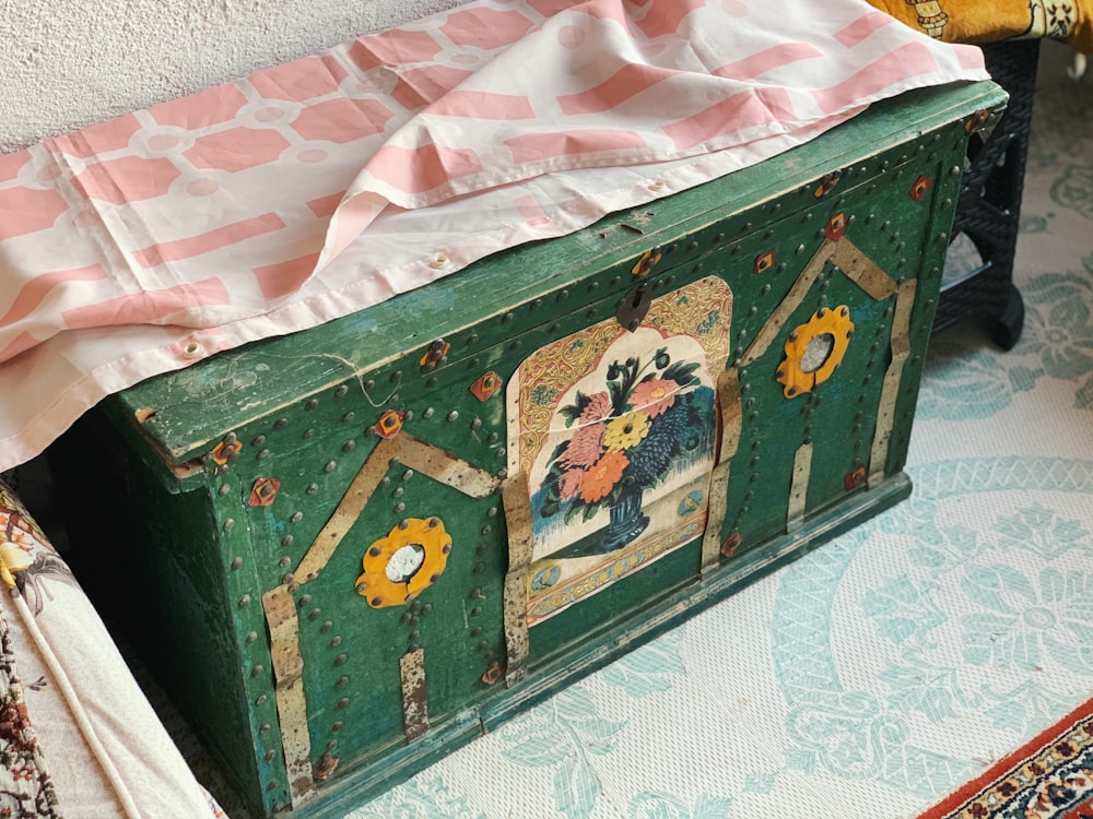 brown wooden chest box on white textile