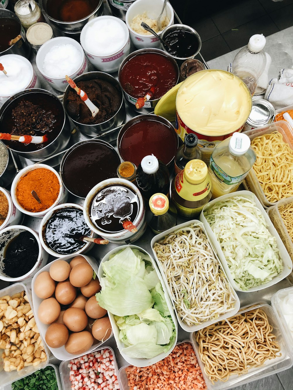 assorted spices on plastic cups