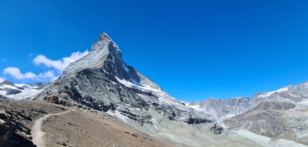 gray and white mountain under blue sky during daytime