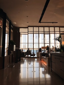 a room with a lot of people sitting at a table